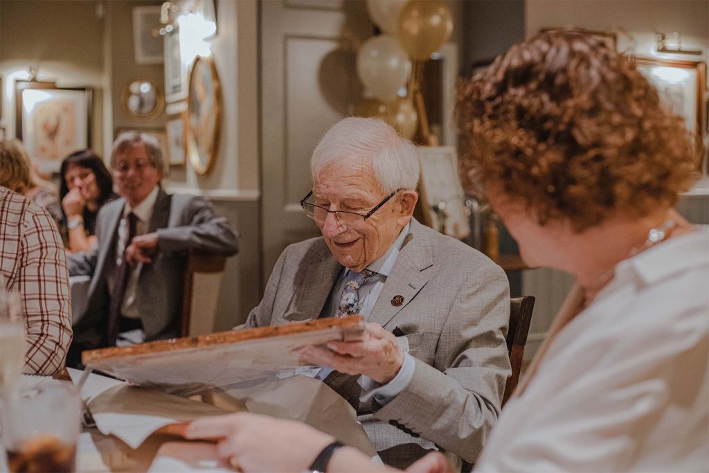 Man looking at gift