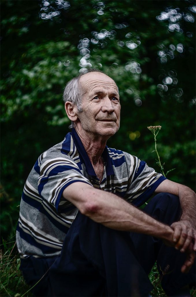 man sat in a garden