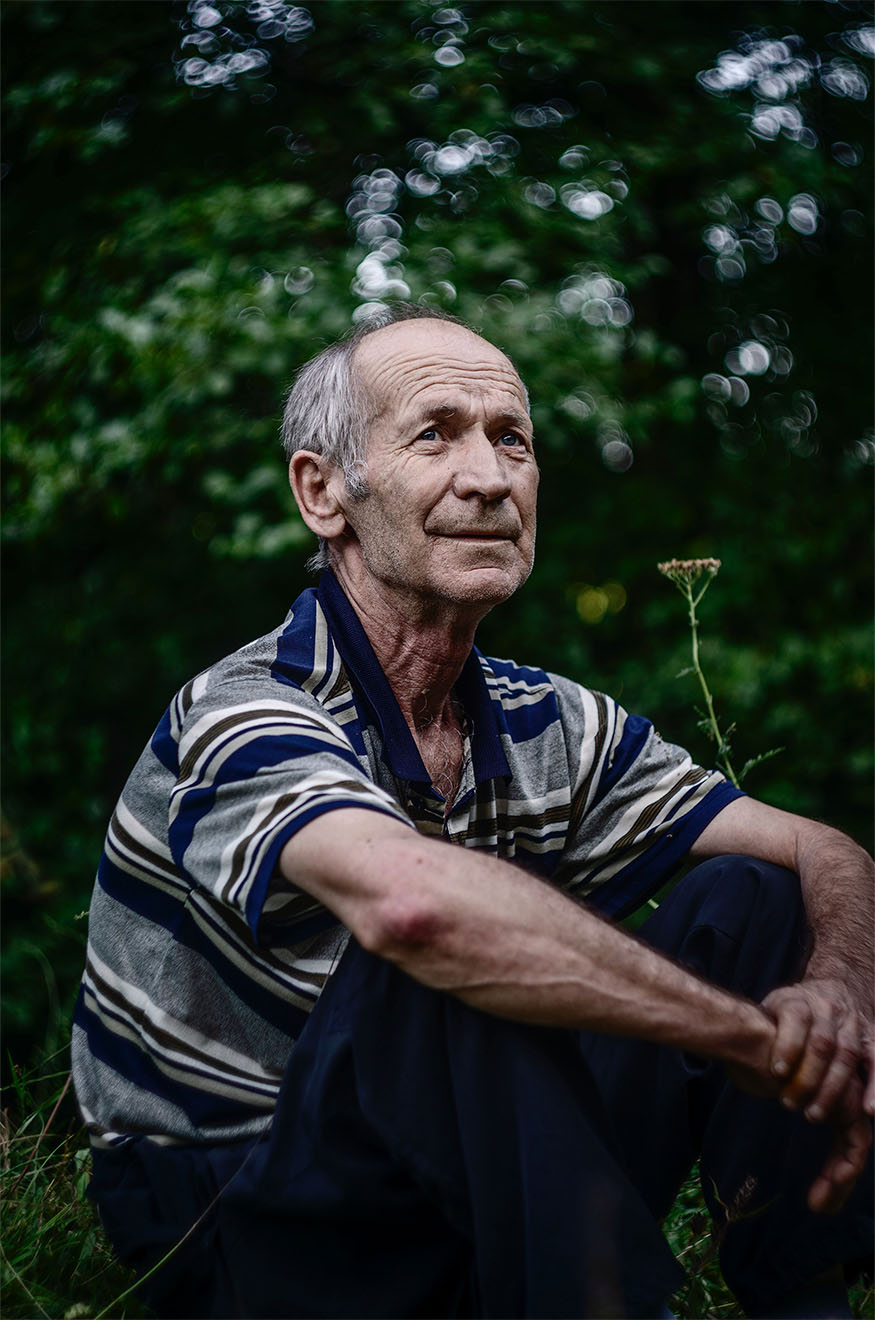 man sat in a garden