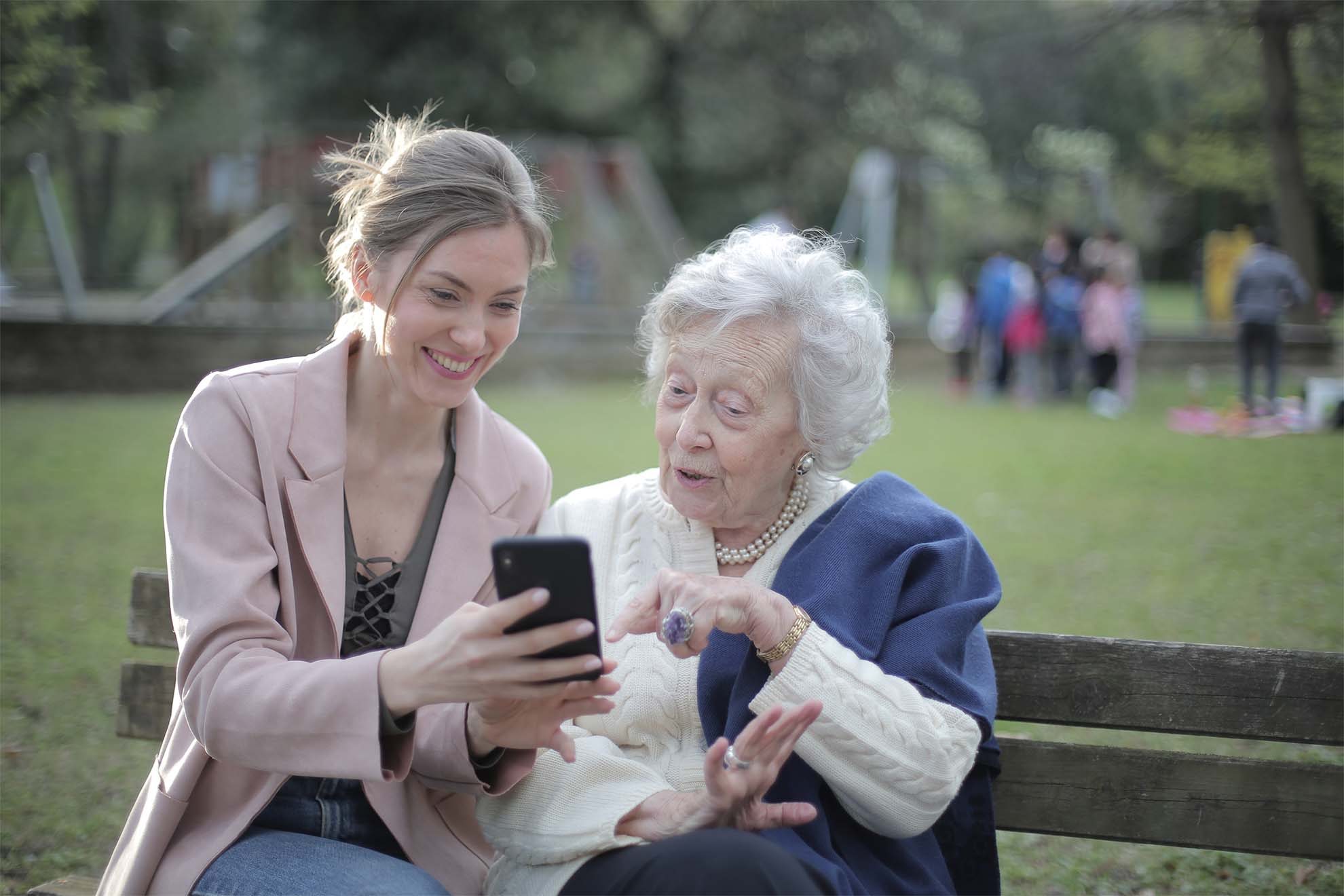 Lady and daughter looking at phone