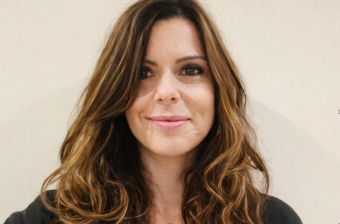 female care home manager with long brown hair