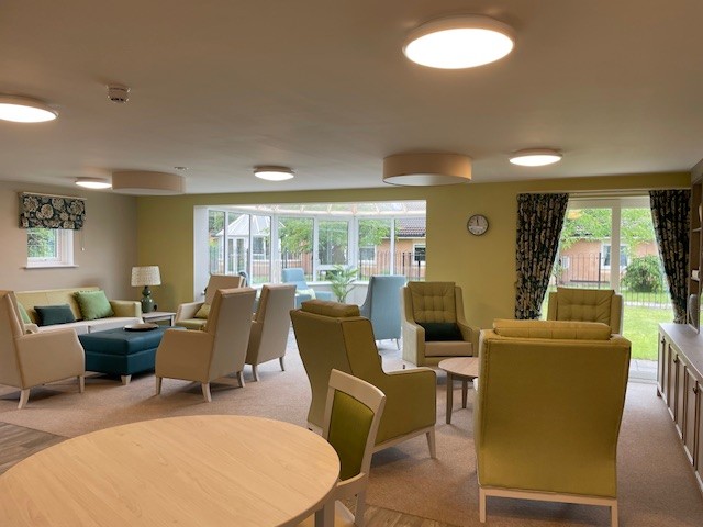 care home lounge with comfy armchairs
