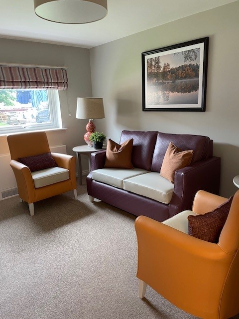orange and purple sofas and armchairs